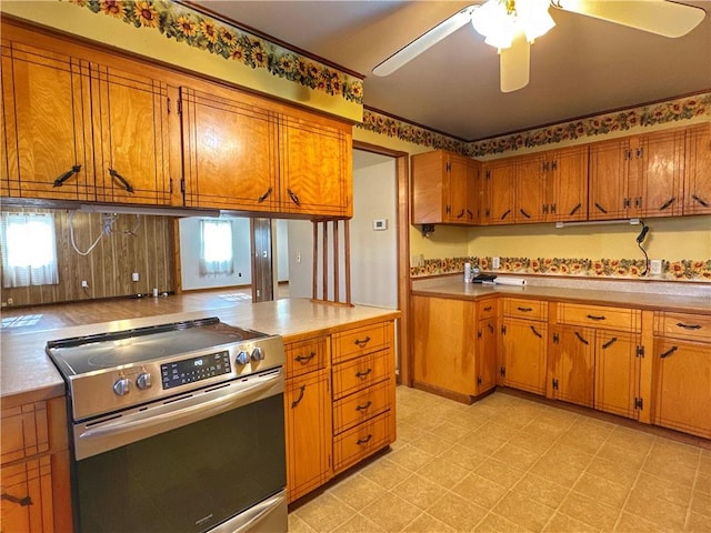 kitchen featuring ceiling fan and stainless steel electric range