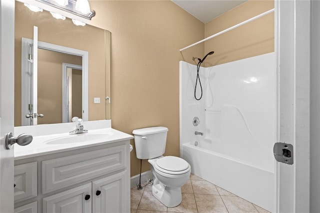 full bathroom with washtub / shower combination, tile patterned floors, toilet, and vanity