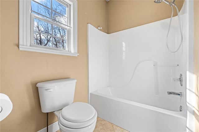 bathroom featuring tile patterned floors, toilet, and shower / bath combination