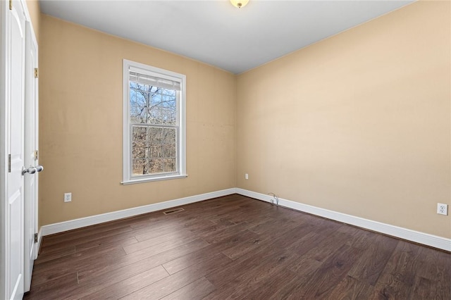 unfurnished room featuring dark hardwood / wood-style floors