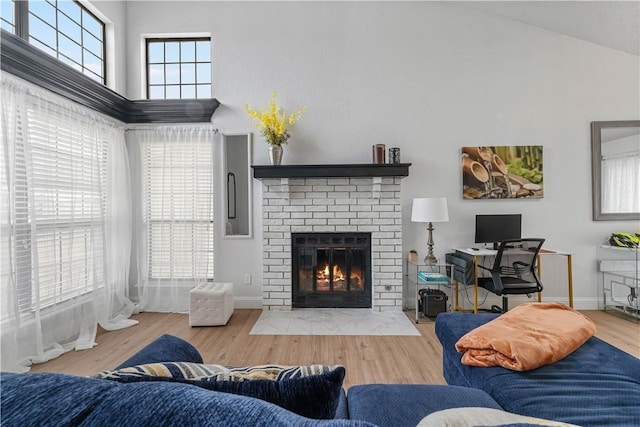 living room featuring hardwood / wood-style flooring and a fireplace