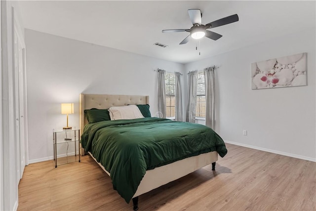 bedroom featuring hardwood / wood-style flooring and ceiling fan