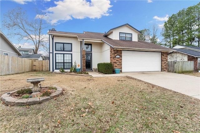 view of front of house featuring a garage and a front yard