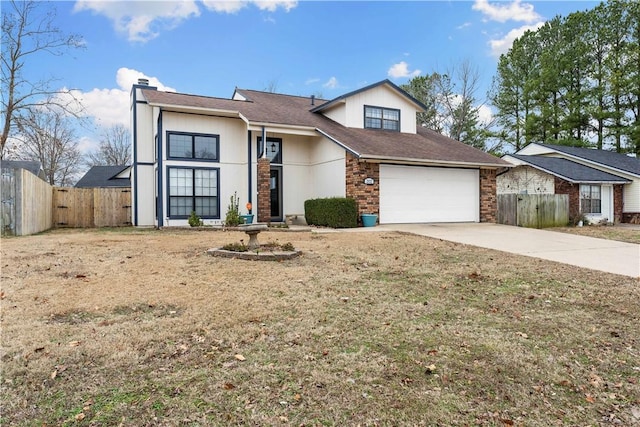 view of front facade featuring a garage and a front yard