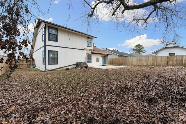 back of house featuring central AC and a patio area