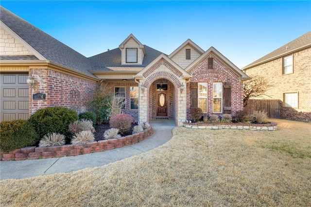 view of front of property featuring a garage and a front yard