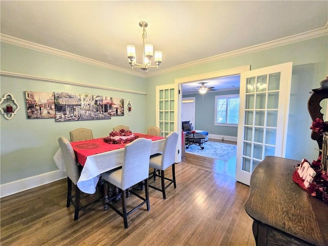 dining space featuring ornamental molding, hardwood / wood-style floors, and a notable chandelier