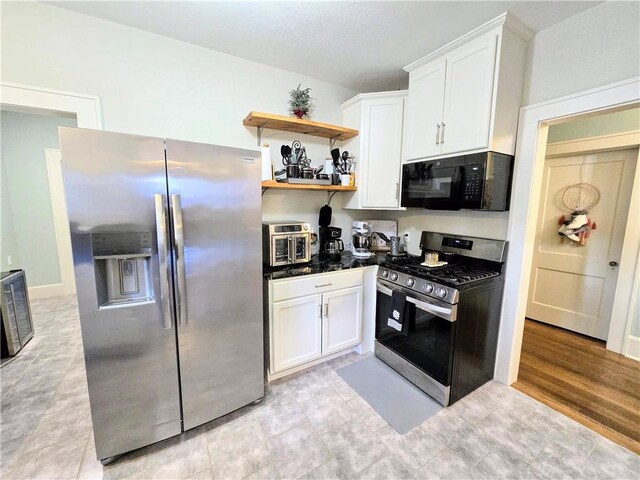 kitchen with stainless steel appliances and white cabinets