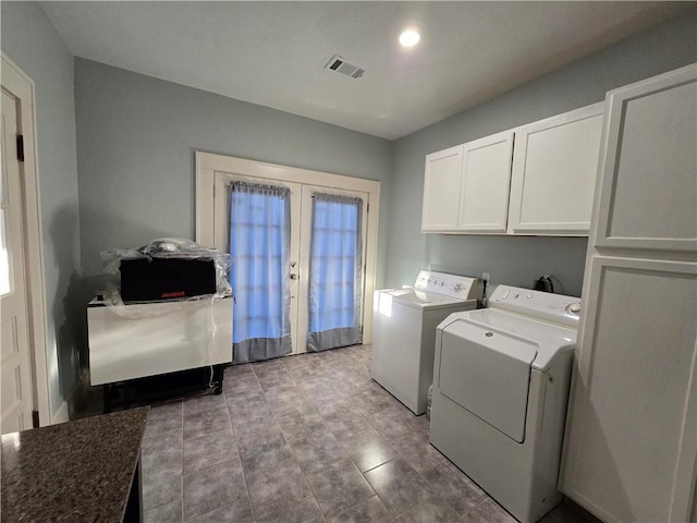 laundry room with light tile patterned flooring, washing machine and dryer, cabinets, and french doors