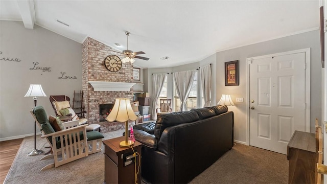 living room featuring a fireplace, lofted ceiling with beams, and ceiling fan