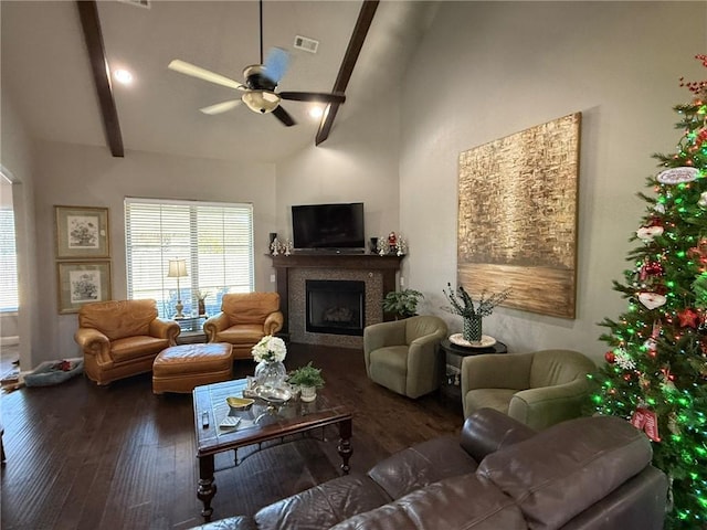 living room with ceiling fan, high vaulted ceiling, dark hardwood / wood-style floors, and beamed ceiling