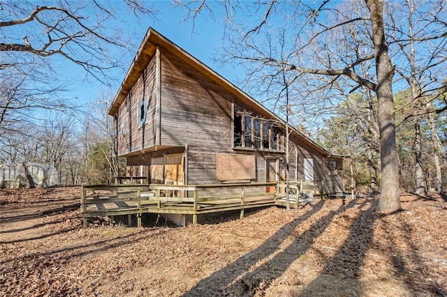 view of home's exterior featuring a wooden deck