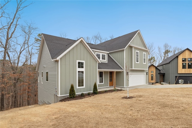 view of front of property with a garage and a front yard