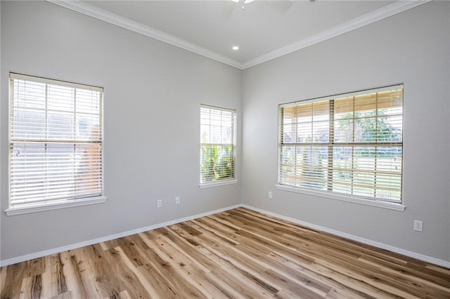 unfurnished room with ornamental molding and light hardwood / wood-style flooring