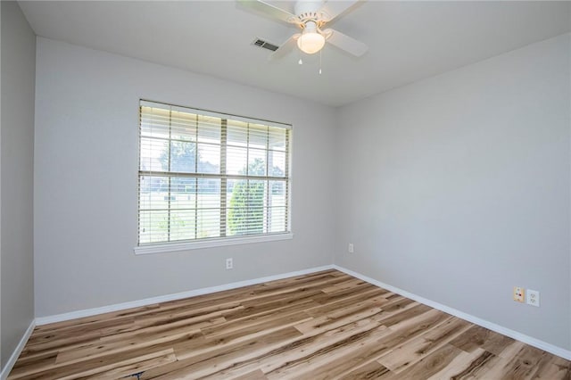 unfurnished room with ceiling fan and light hardwood / wood-style floors