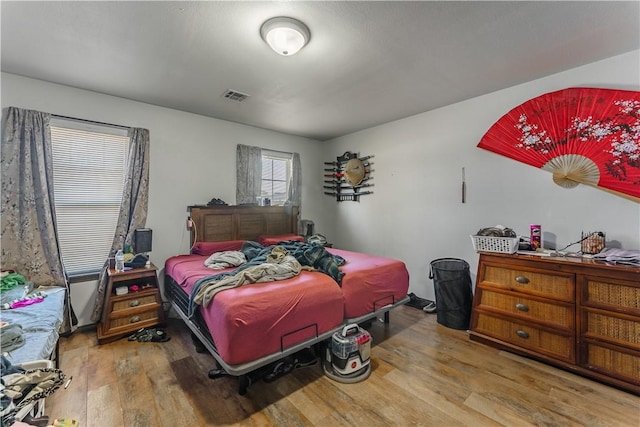 bedroom with hardwood / wood-style flooring