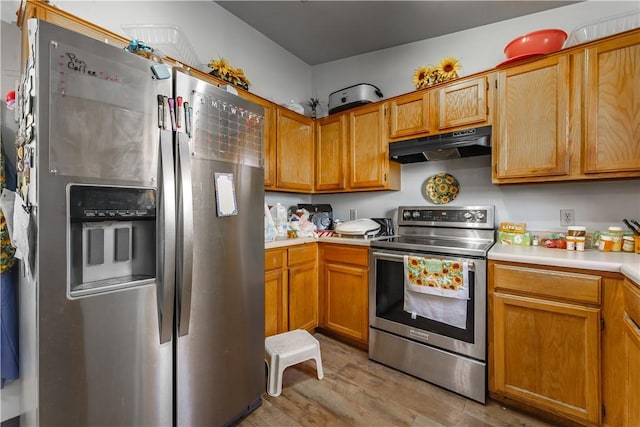 kitchen featuring stainless steel appliances and light wood-type flooring