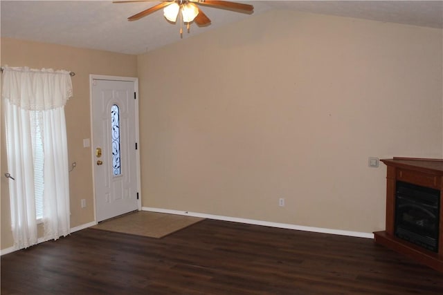 foyer featuring ceiling fan, plenty of natural light, dark hardwood / wood-style flooring, and vaulted ceiling