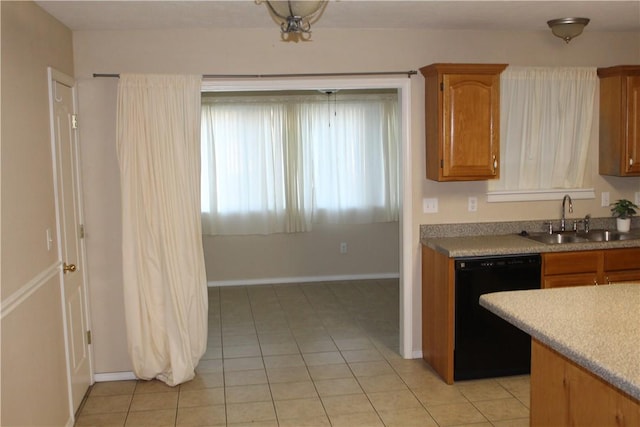 kitchen with dishwasher, sink, and light tile patterned floors