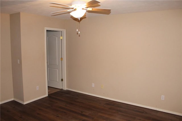 empty room featuring ceiling fan and dark hardwood / wood-style floors