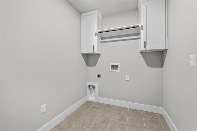 laundry area with electric dryer hookup, light tile patterned floors, hookup for a washing machine, and cabinets