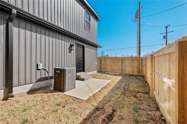 exterior space with central AC unit and a patio area