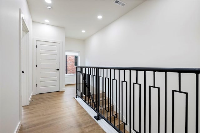 corridor with light wood-type flooring