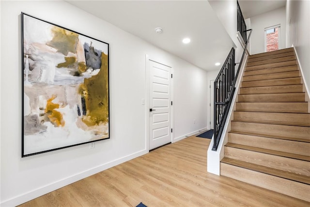 stairway featuring hardwood / wood-style flooring