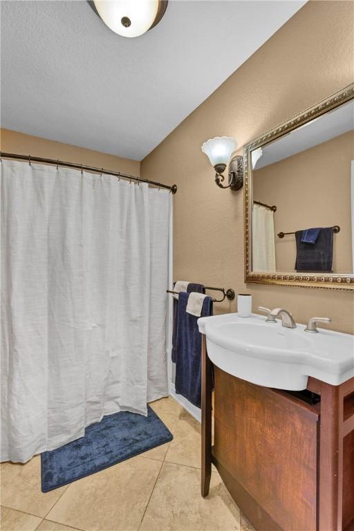 bathroom featuring vanity and tile patterned flooring