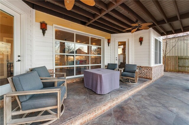 view of patio featuring ceiling fan