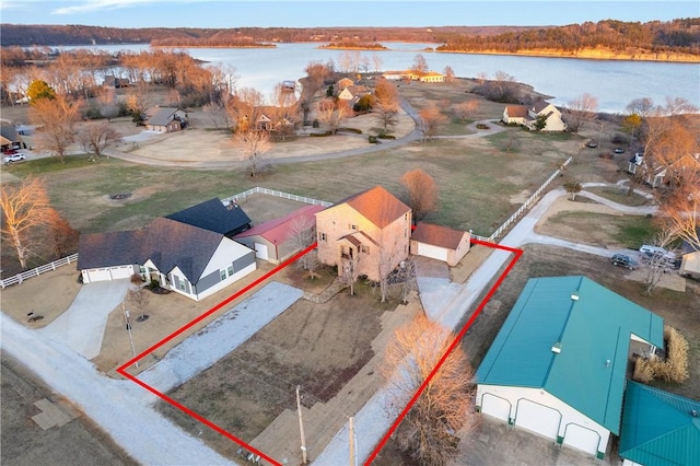 birds eye view of property with a water view