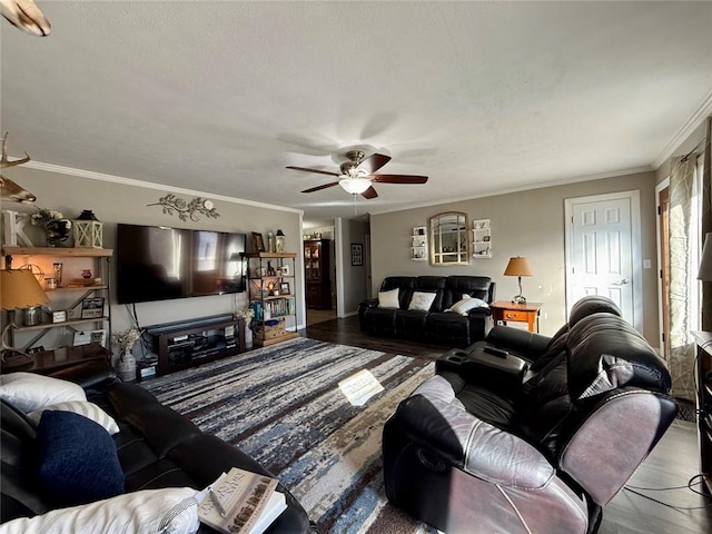 living room with hardwood / wood-style flooring, ornamental molding, and ceiling fan