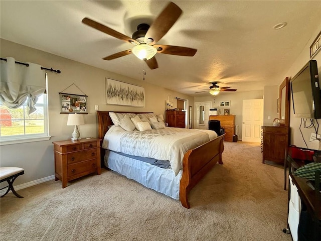 carpeted bedroom with ceiling fan