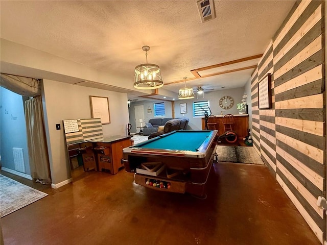 recreation room with ceiling fan, indoor bar, pool table, and a textured ceiling