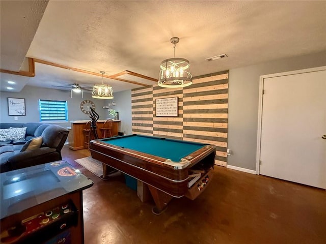 rec room with ceiling fan, billiards, a textured ceiling, and bar area