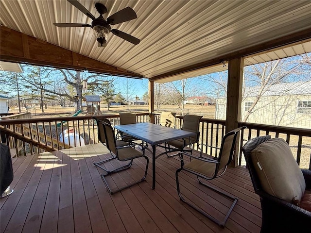 deck with ceiling fan and a playground