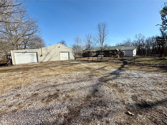 exterior space with an outbuilding and a garage