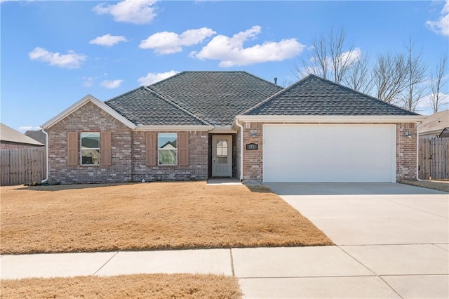 ranch-style home featuring a garage