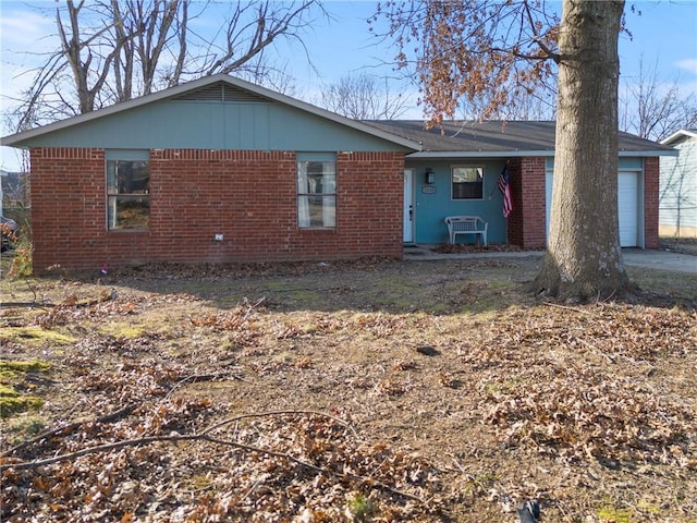 back of house featuring a garage