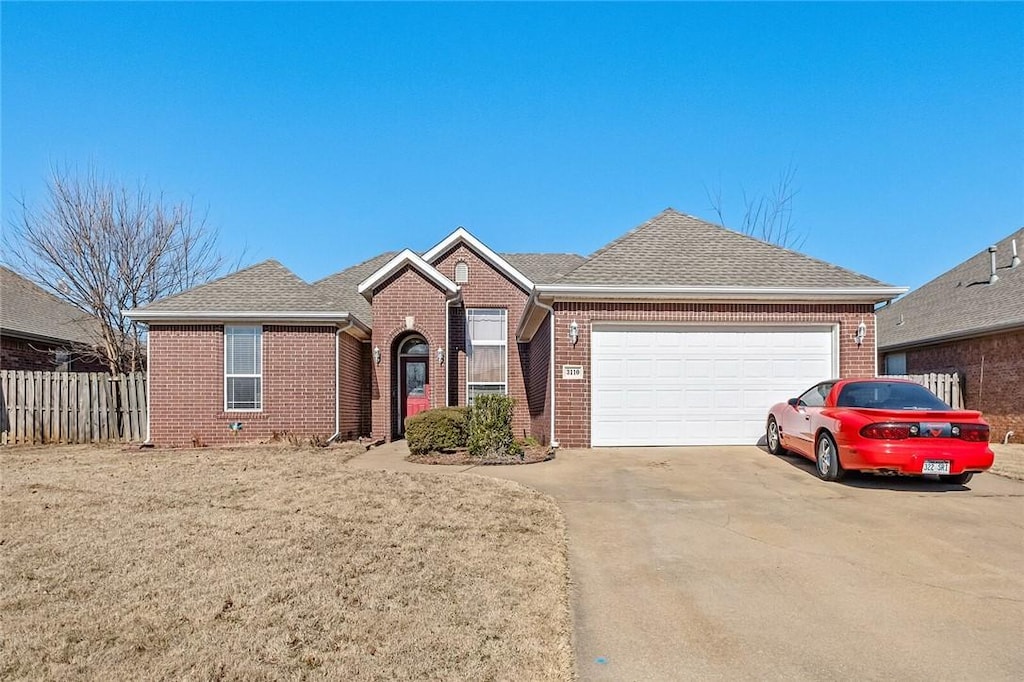 view of front of house featuring a garage and a front yard