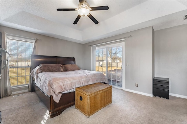 bedroom with access to outside, light carpet, baseboards, and multiple windows