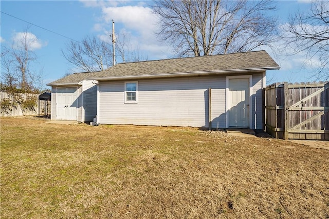 garage featuring a gate and fence