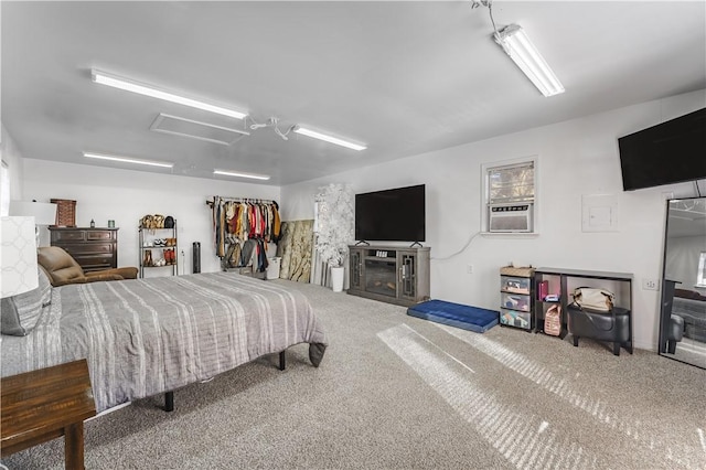 carpeted bedroom featuring a ceiling fan, cooling unit, and a fireplace