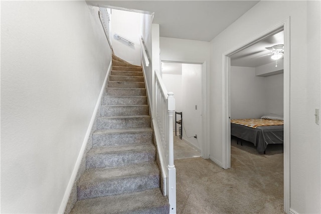 stairs with carpet and baseboards