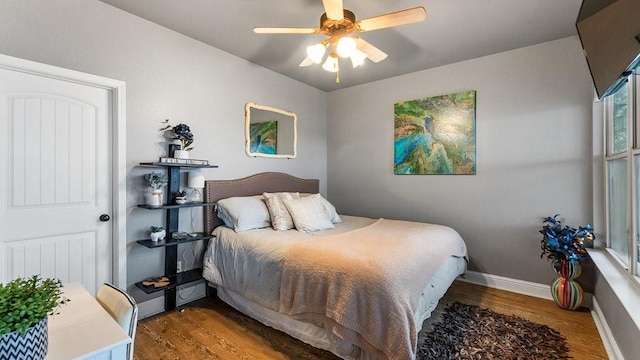 bedroom with hardwood / wood-style flooring and ceiling fan