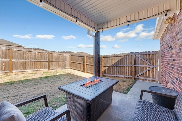 view of patio / terrace with an outdoor fire pit