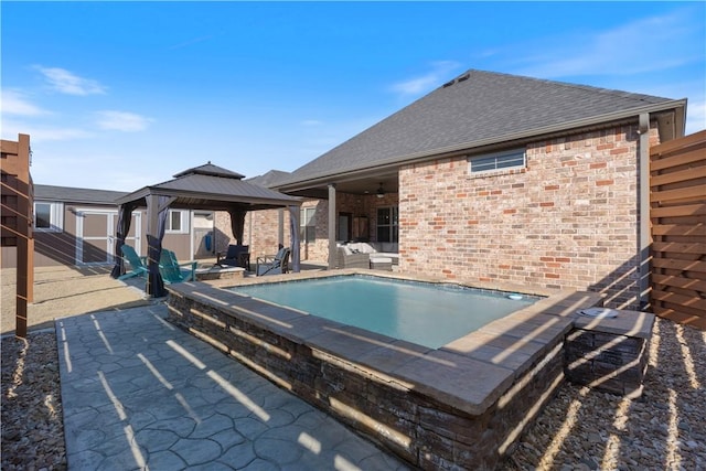 view of pool featuring a gazebo, a patio, and ceiling fan