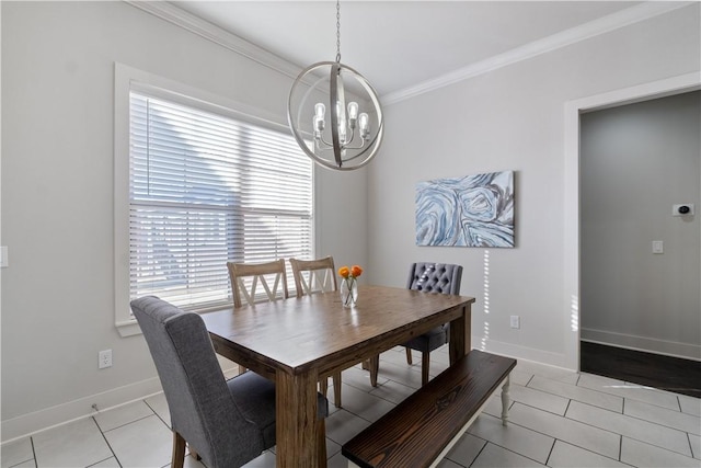 dining area featuring ornamental molding, a chandelier, and light tile patterned floors