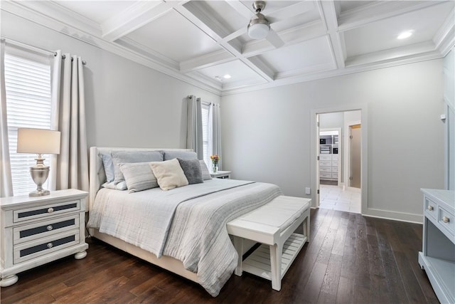 bedroom featuring coffered ceiling, ornamental molding, dark hardwood / wood-style floors, and beamed ceiling