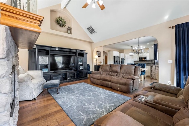 living room featuring beam ceiling, ceiling fan with notable chandelier, high vaulted ceiling, and dark hardwood / wood-style floors